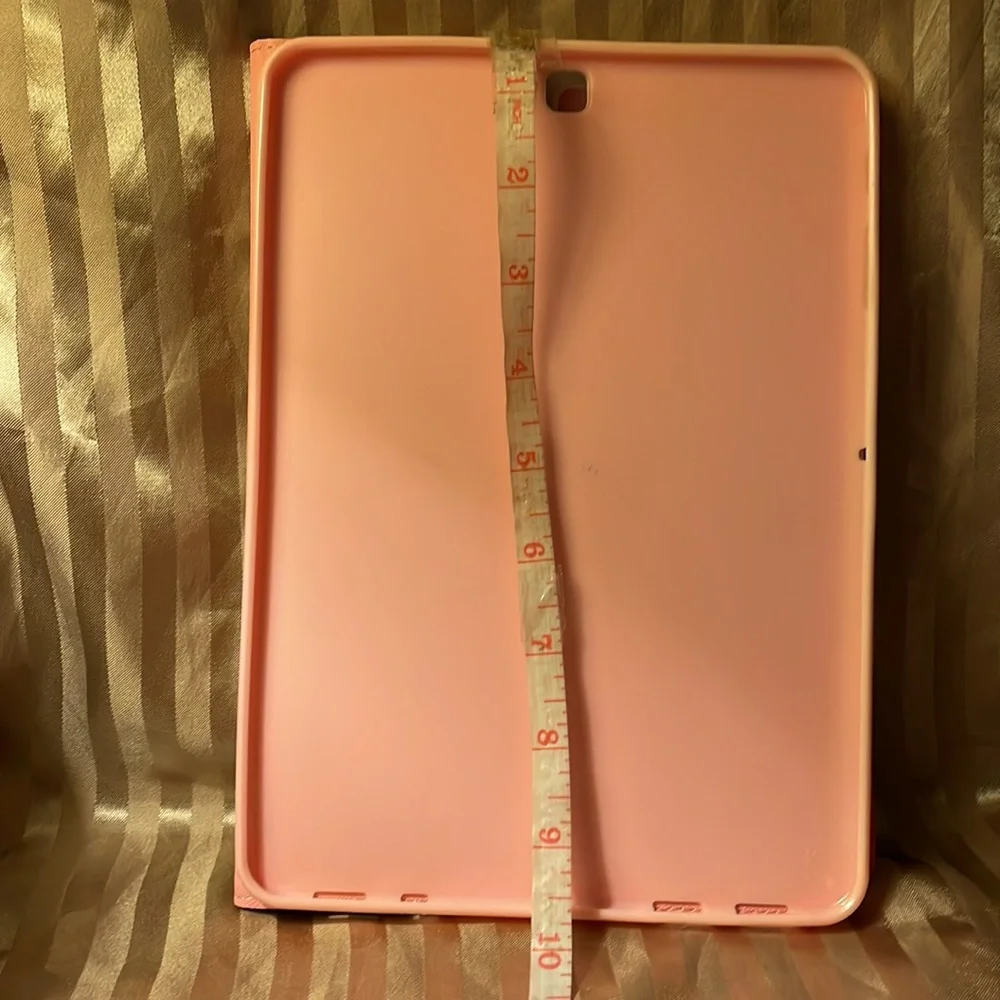 Floral pink colored tablet cover- not sure what type tablet fits in it.